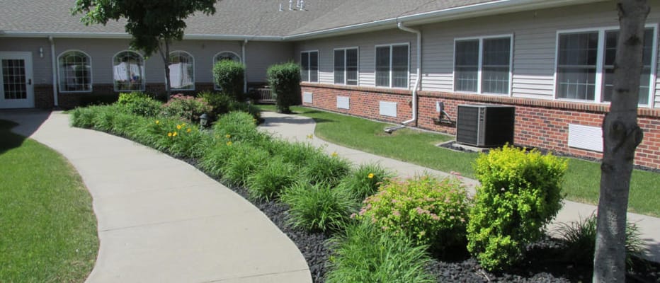 Well-maintained garden path with flowers and shrubs