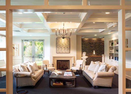 Bright and inviting common area with seating and fireplace
