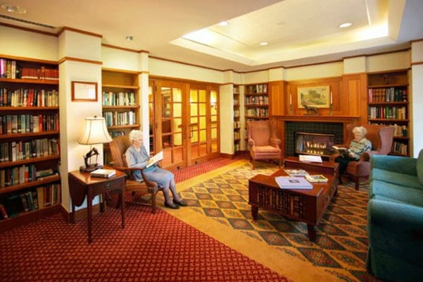 Residents reading in a cozy library area