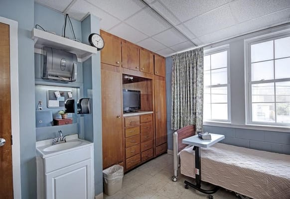 Private resident room with a bed and amenities