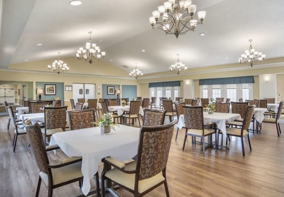 Bright dining area with tables and chairs