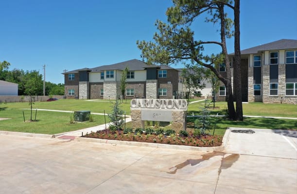 Exterior view of The Carlstone facility with landscaped area