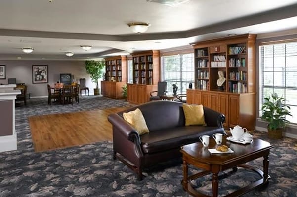 Common area with seating and bookshelves