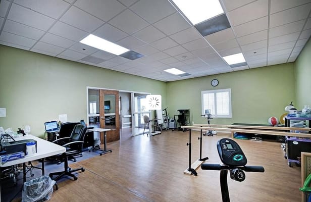 Interior of a therapy room with exercise equipment