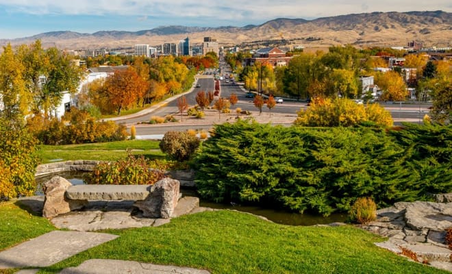 A scenic view of landscaped outdoor space with colorful trees