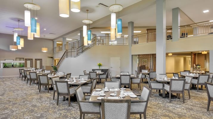 Elegant dining room with tables set for meals