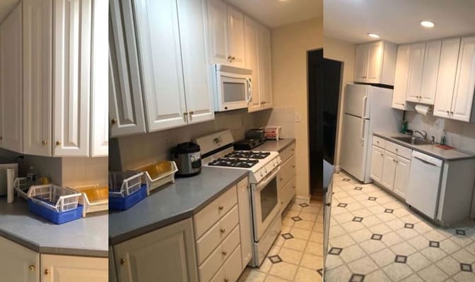 A bright, clean kitchen with white cabinets, appliances, and a tiled floor.