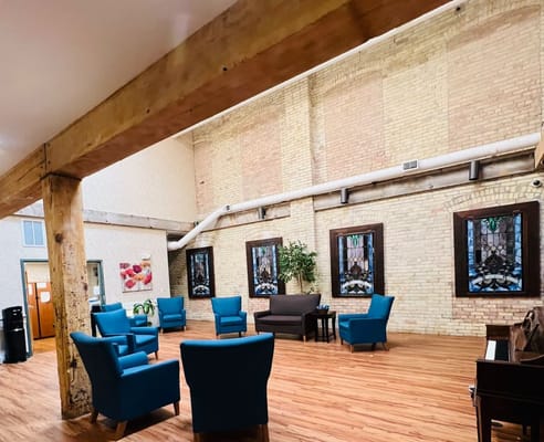 Interior common area with seating and decorative windows