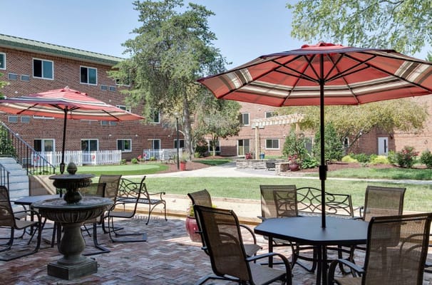 Outdoor patio area with tables and umbrellas