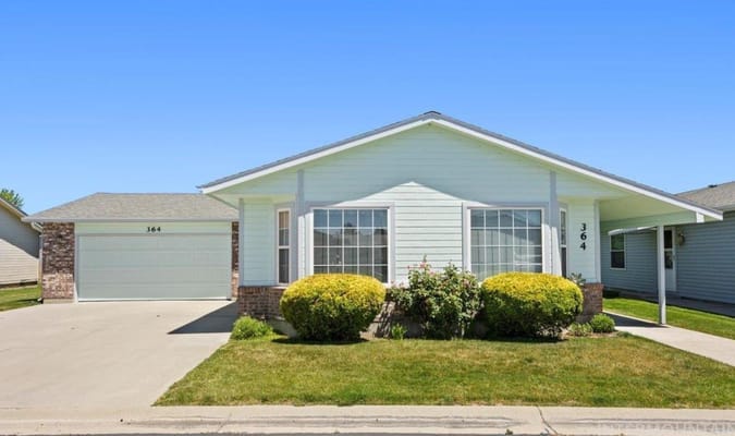 Exterior view of a residential building with landscaping
