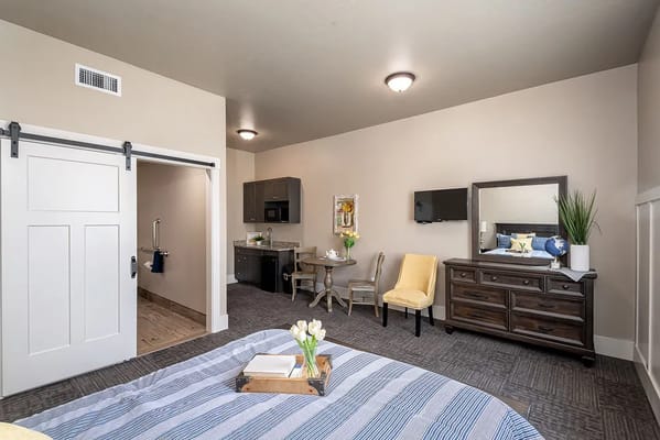 A well-furnished interior view of a private resident room