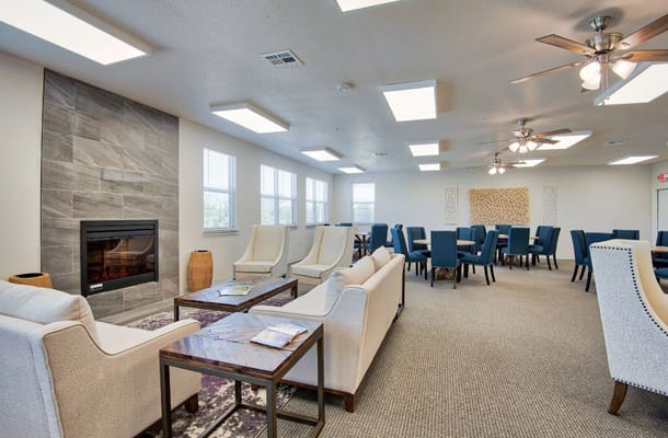 Bright common area with seating and dining space