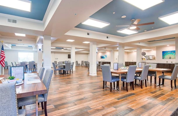 Dining area with tables and chairs arranged neatly