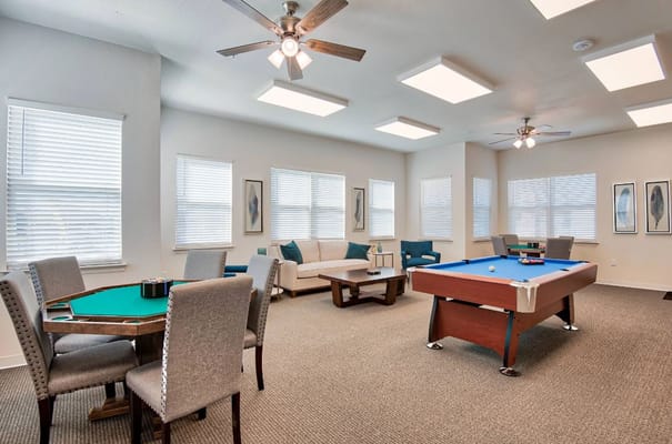Common area with seating and games for residents