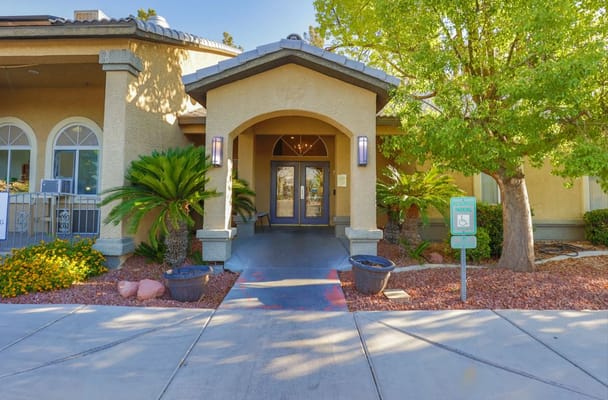 Entrance of Villa Court Assisted Living with landscaping