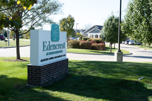 Sign for Edencrest at Green Meadows showing assisted living and memory care services.