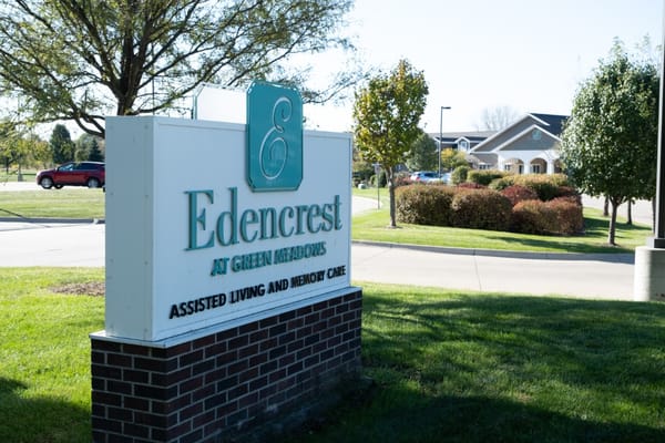 Sign for Edencrest at Green Meadows showcasing assisted living and memory care services.
