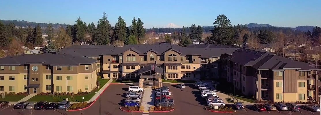 Aerial view of the assisted living facility with surrounding landscape