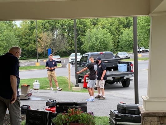 Staff members conducting an outdoor activity or event