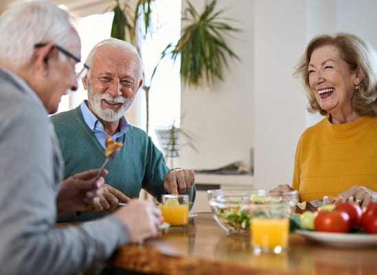 Residents enjoying a meal and conversation together