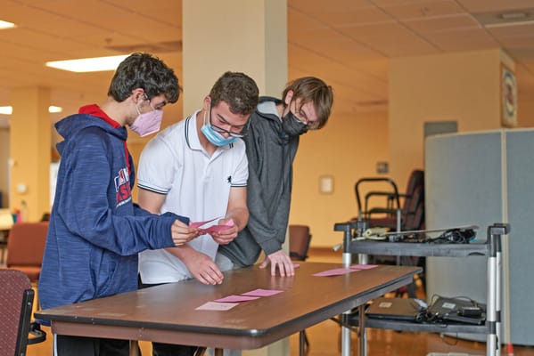 Residents participating in an engaging activity indoors