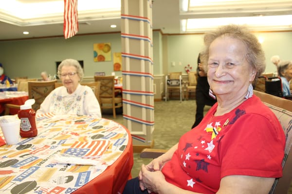 Residents enjoying a social gathering with festive decor