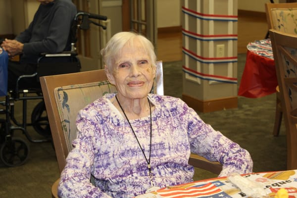 Resident smiling in a common area