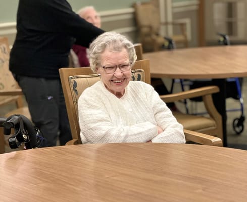 A smiling resident in a common area