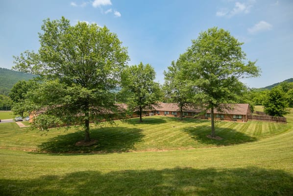 Exterior view of the facility surrounded by trees