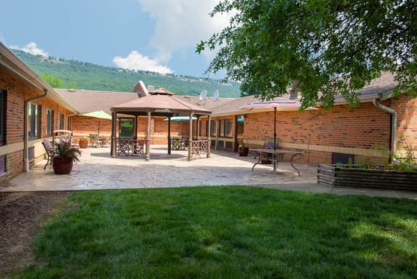 Outdoor courtyard with seating and umbrellas
