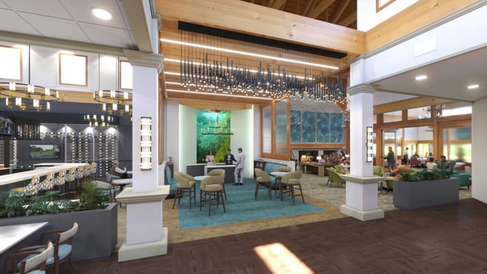 Interior common area with residents and staff socializing