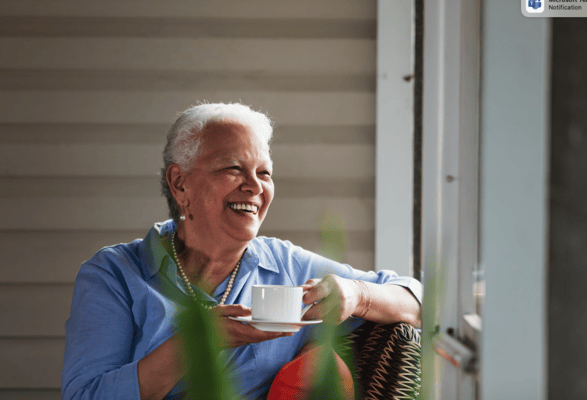 Senior resident enjoying tea in a cozy environment