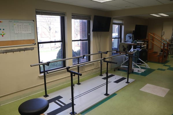 Physical therapy room with parallel bars