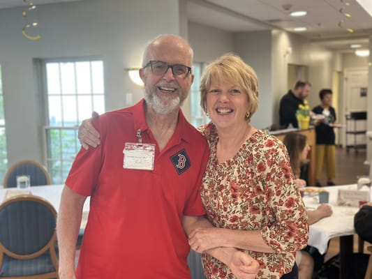 Residents enjoying a happy moment in the dining area
