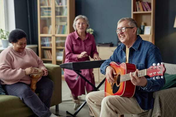 Residents playing music together in a common area