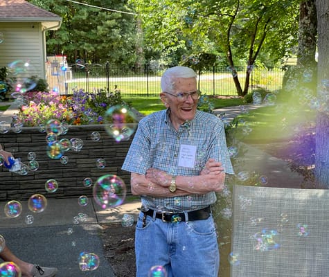 Resident enjoying bubble activity in outdoor area
