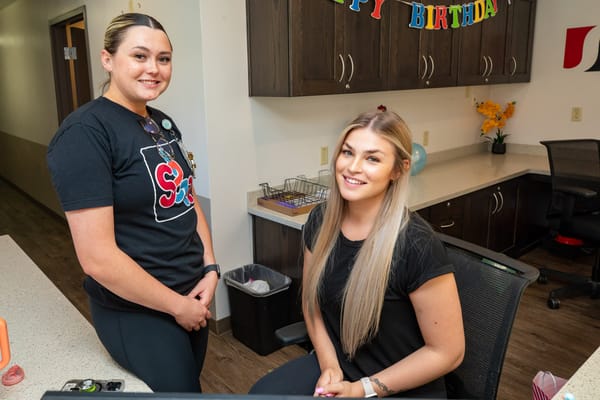 Staff celebrating a resident's birthday in the lobby