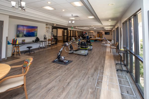 Interior view of a rehabilitation gym with fitness equipment