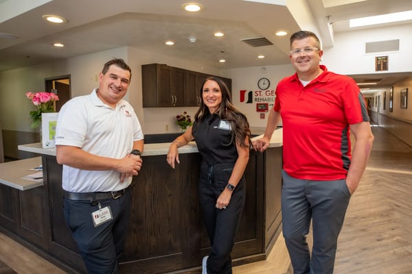 Staff members at the reception desk in the facility