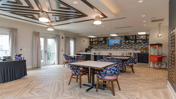 Common area with colorful seating and a coffee station