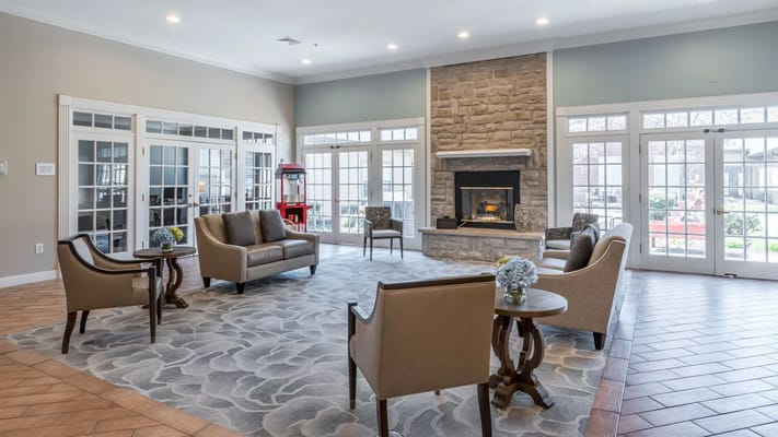 Cozy interior lounge area with seating and fireplace
