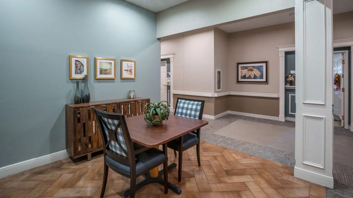 Bright common area with tables and chairs