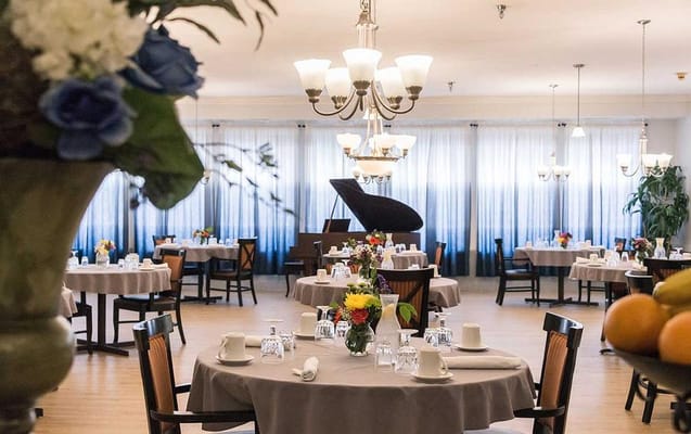 Elegant dining room with floral centerpieces and table settings