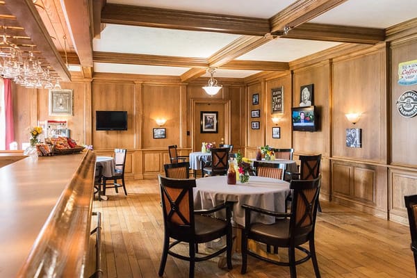 Interior dining room with wooden paneling and tables