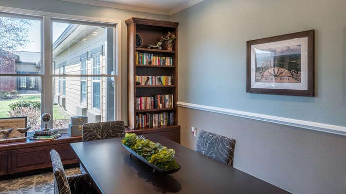 Interior view of a cozy common area with bookshelves