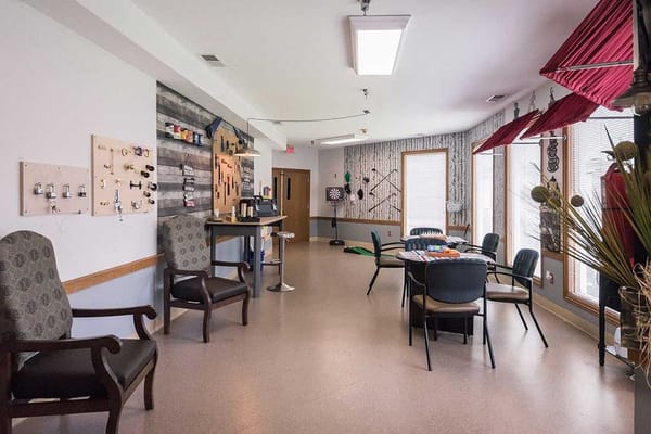 Common area with seating and activity supplies