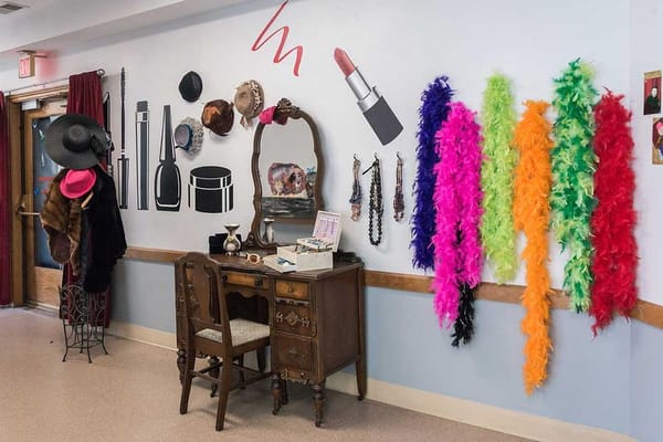 Decorative activity wall in a common area with costumes