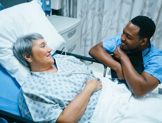 Patient interacting with a nurse in a care setting