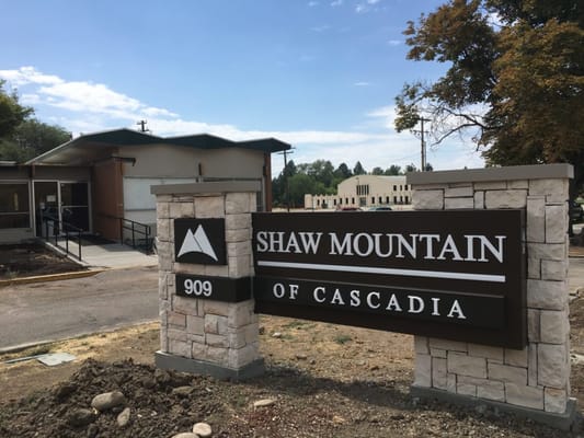 Exterior view of Shaw Mountain facility with signage