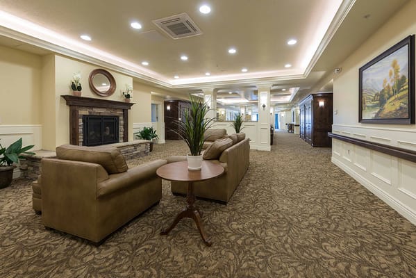 Common area with seating and fireplace